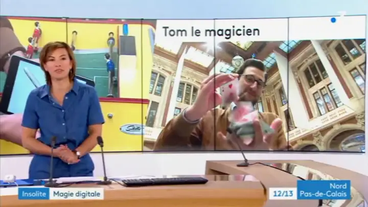 un groupe de spectateurs regardant tom coss le magicien ipad